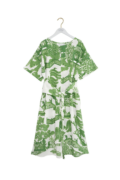 One Hundred Stars green willow print dress hanging on branded hanger on white background